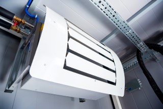 View of industrial air conditioning unit on wall